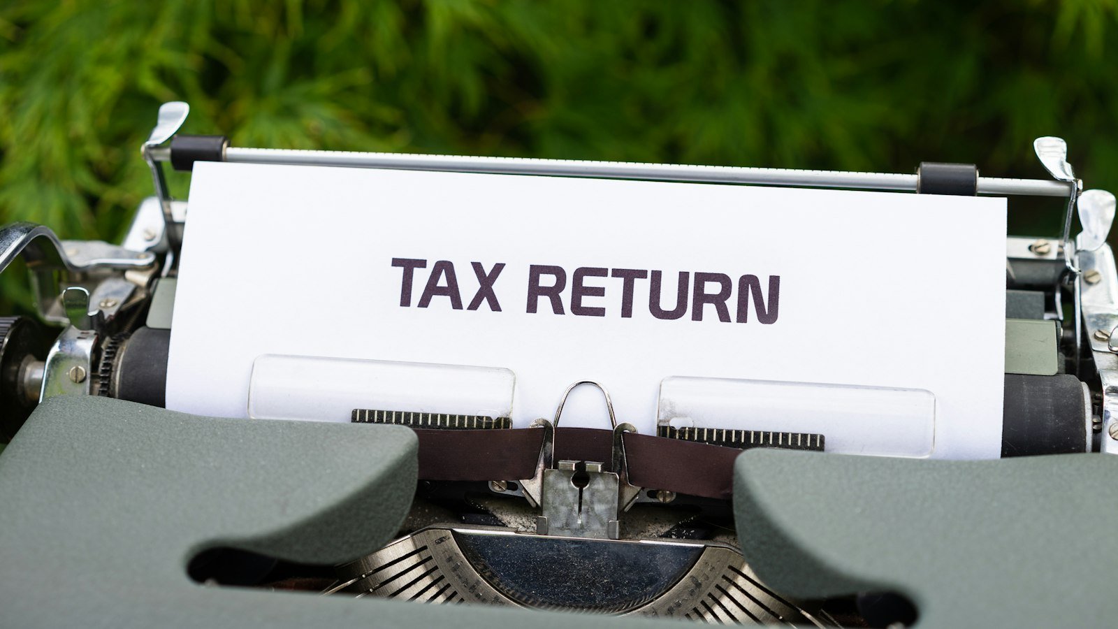 Typewriter with a tax return note