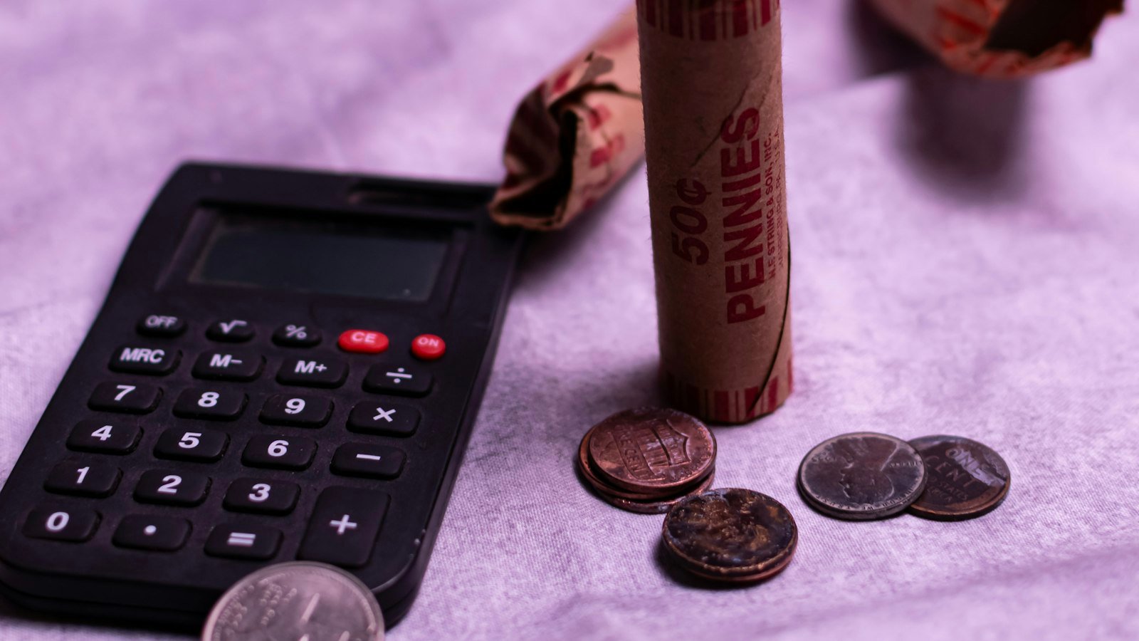 Coins and a calculator for saving money on taxes