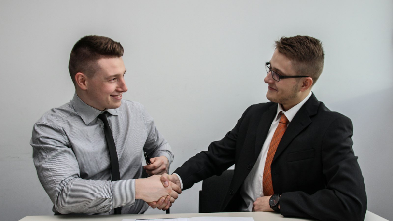 Accountant and small business owner shaking hands